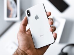 person holding silver iPhone X