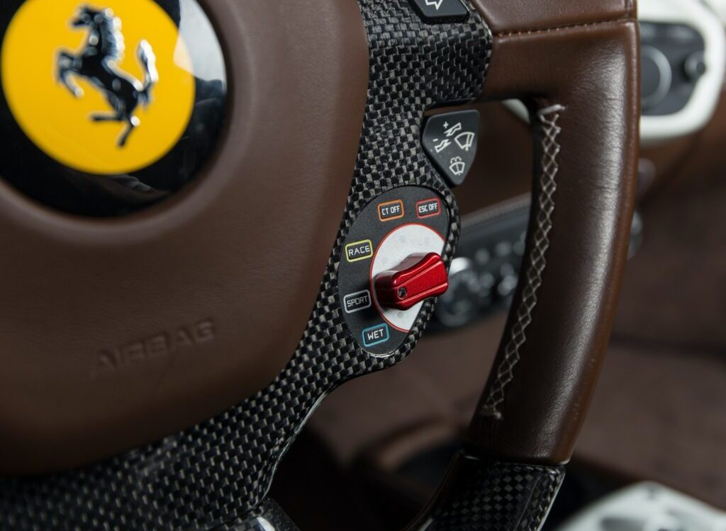 brown and black Ferrari car steering wheel