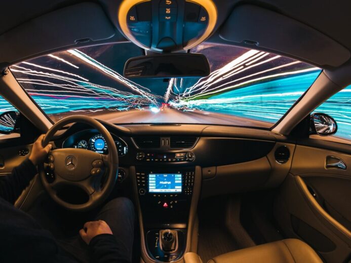 time lapse photography of man riding car