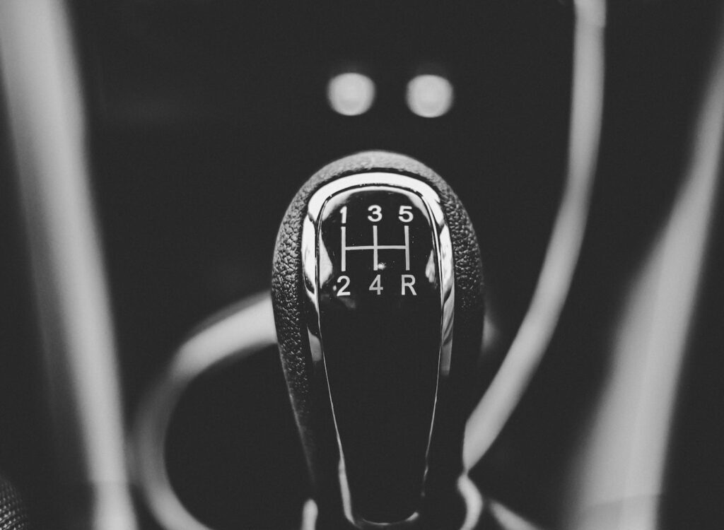 focus photography of car shift gear