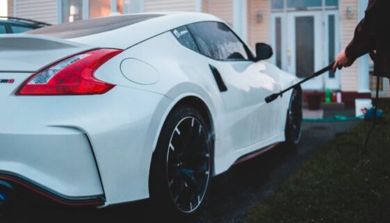 white porsche 911 parked near white house