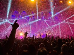 crowd raising their hands