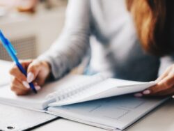 woman writing using pen