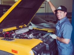 man holding open-wide car trunk