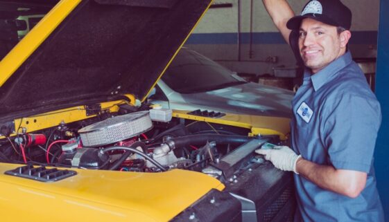 man holding open-wide car trunk