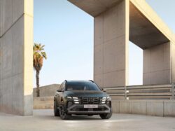 a black suv parked in front of a building