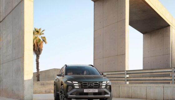a black suv parked in front of a building