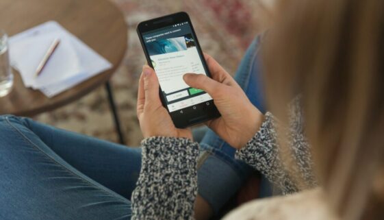 person holding black android smartphone