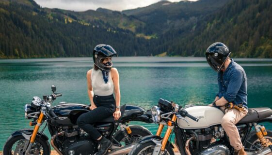 woman in black helmet riding on black motorcycle during daytime