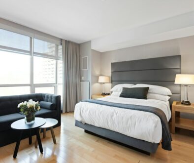 white bed linen on bed