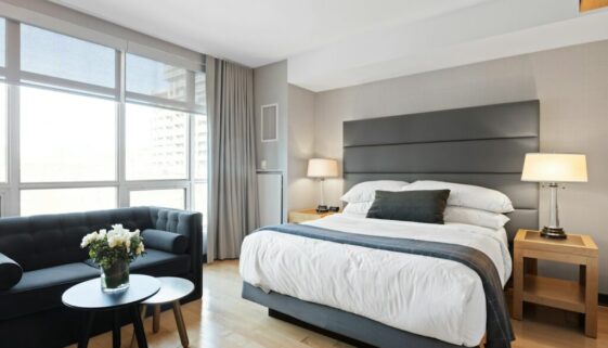 white bed linen on bed