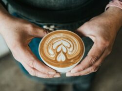 focus photography of coffee artwork