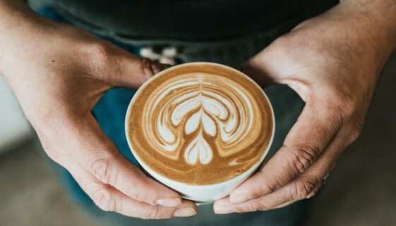 focus photography of coffee artwork