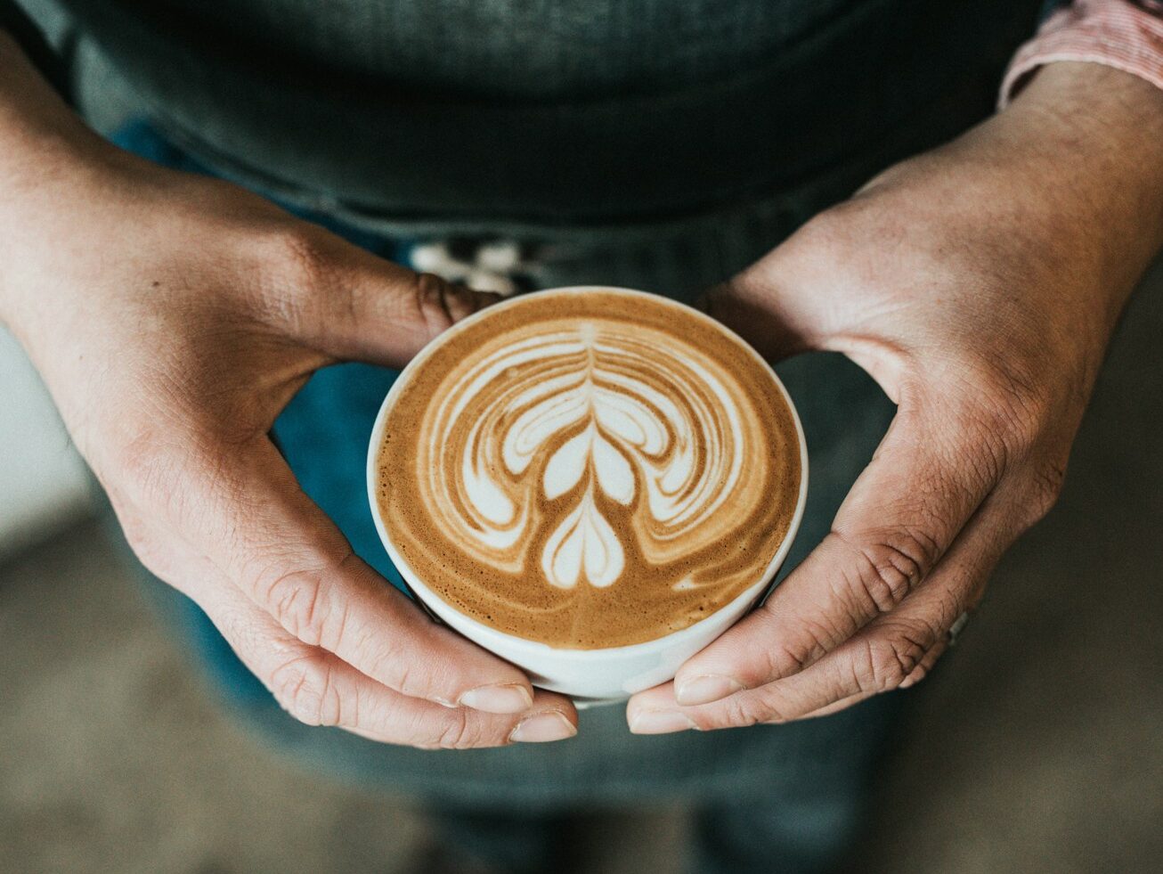 focus photography of coffee artwork