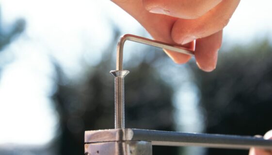 a close-up of a hand holding a metal rod
